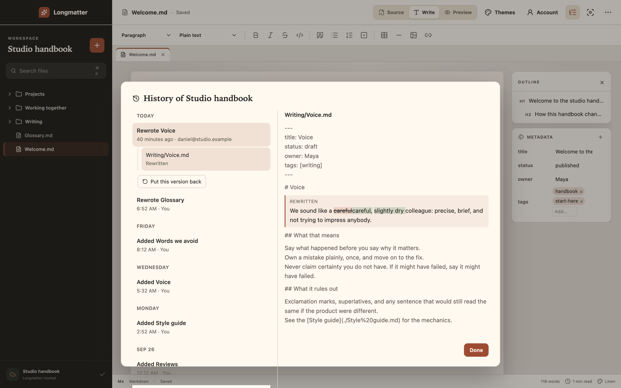 The History dialog listing versions of the project by day with who made each, and a comparison of one page with a button to put that version back.