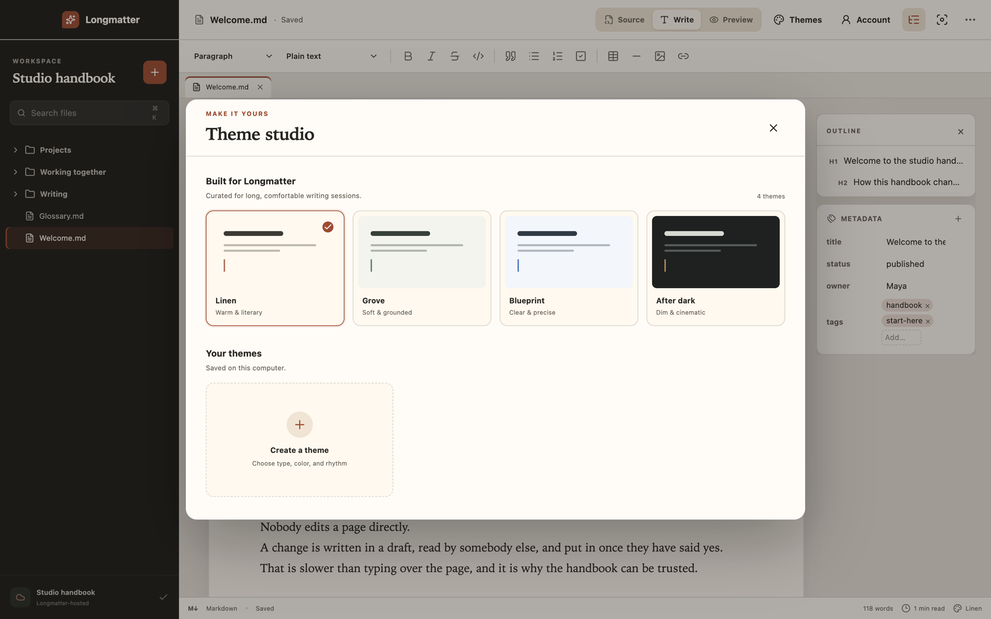 The Theme studio open over the editor, showing four built-in themes as cards, with the one in use checked, and a card for creating a theme.